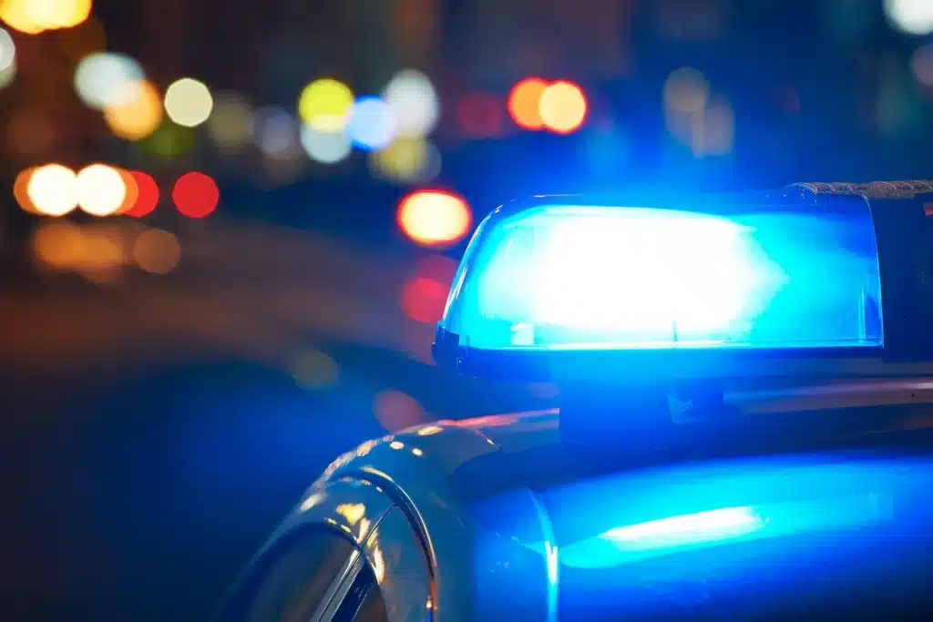 Emergency response vehicle's lights seen at night.