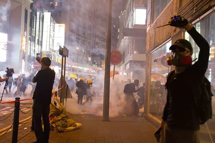 People participating or filming riots in progess.