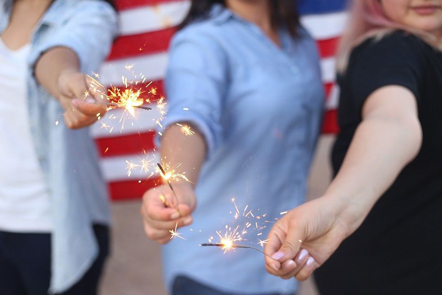 women-holding-sparklers