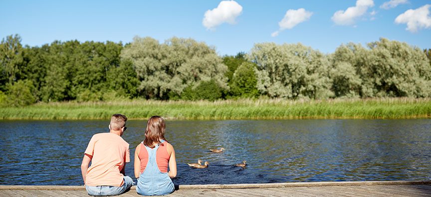 couple-looking-at-river