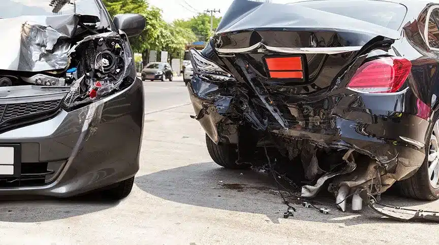 Two cars with front- and back-end damage, after being in an accident.