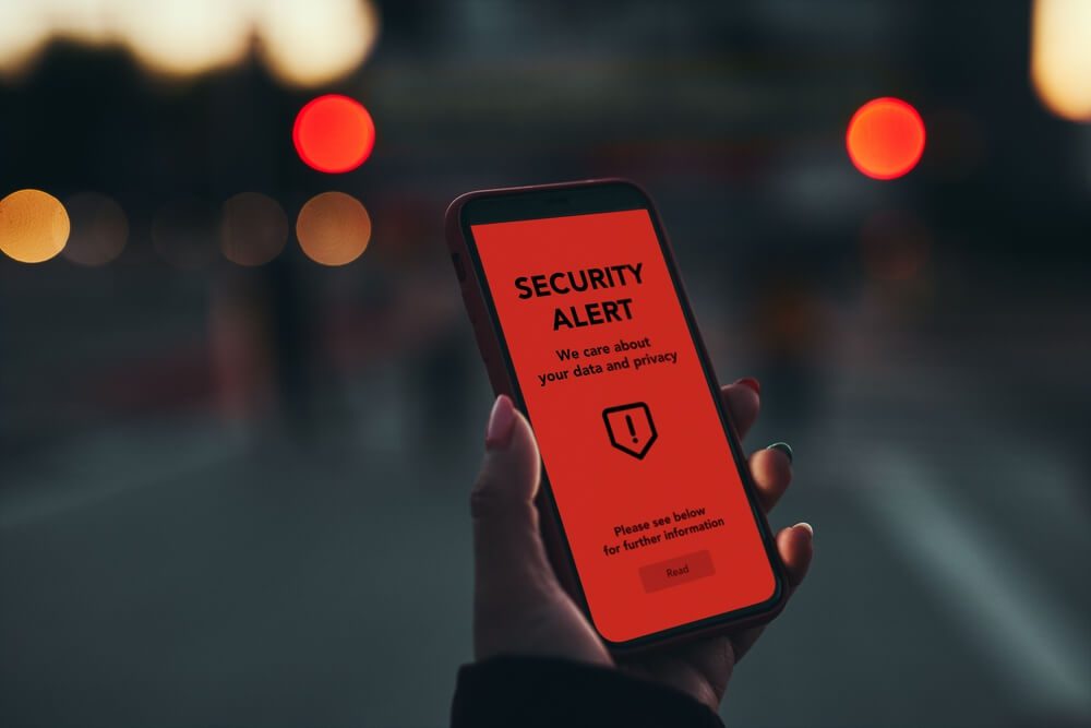 Security alert on smartphone screen.