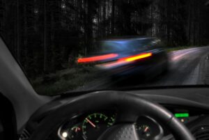 reckless driving in dark wet conditions on narrow rural road