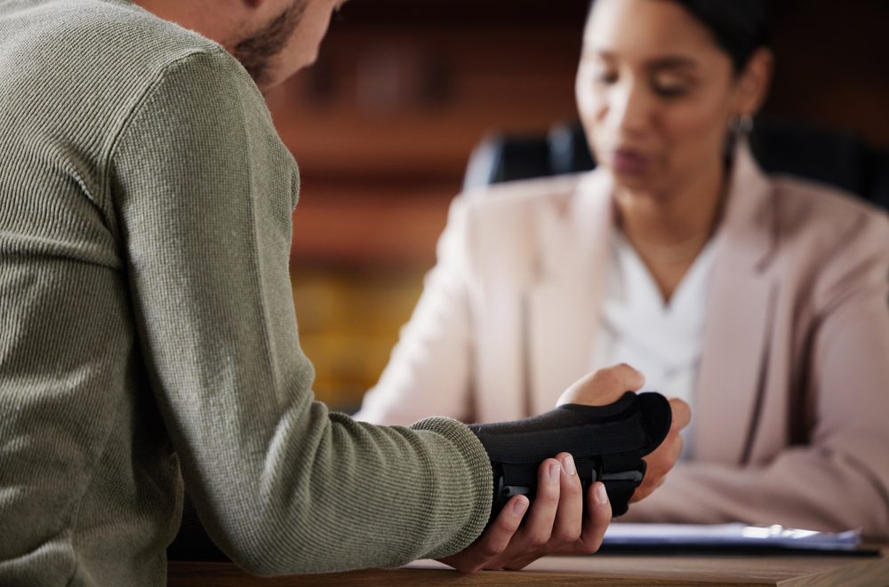 An injured person speaking with an attorney.