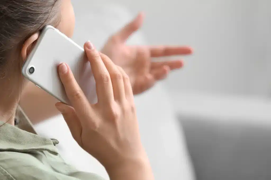Person talking on a cell phone.