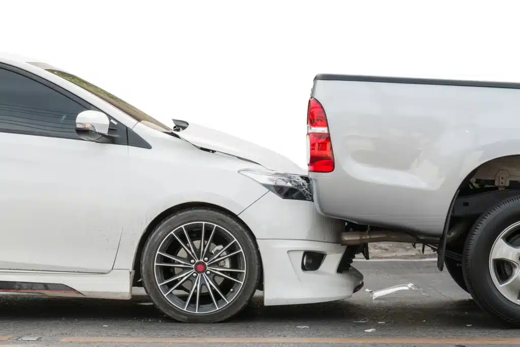 A car rear-ending the back of another car. 