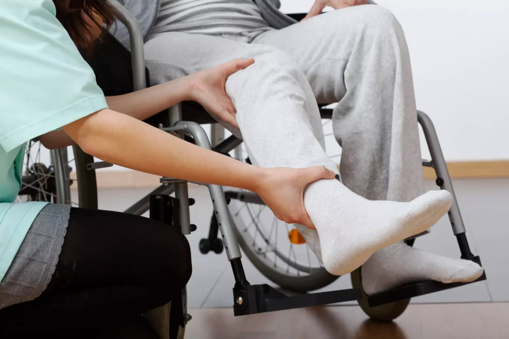 Someone with a leg injury in a wheelchair.