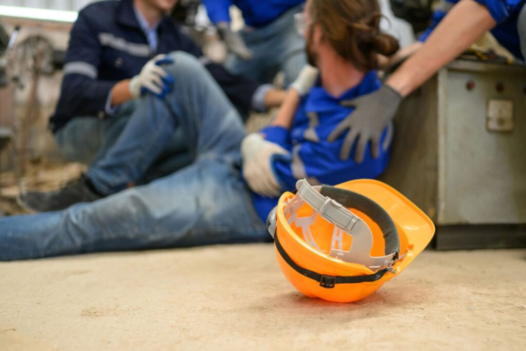 An injured worker on the floor.